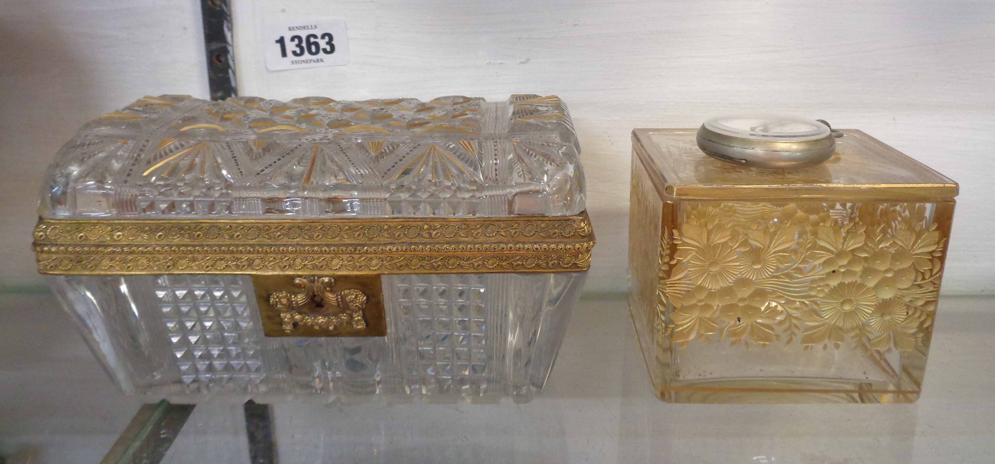 A late 19th Century cut glass casket with gilt metal fittings and gilt and painted highlighting -