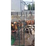 Two garden obelisks, a garden support and three metal wine racks