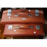 Two vintage red Revelation suitcases