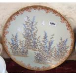 A large early 20th Century Japanese porcelain charger with hand painted decoration, depicting bamboo