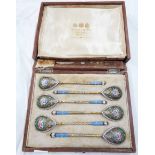 An early 20th Century original wooden cased set of six Russian (Moscow) 84 grade cloisonné decorated