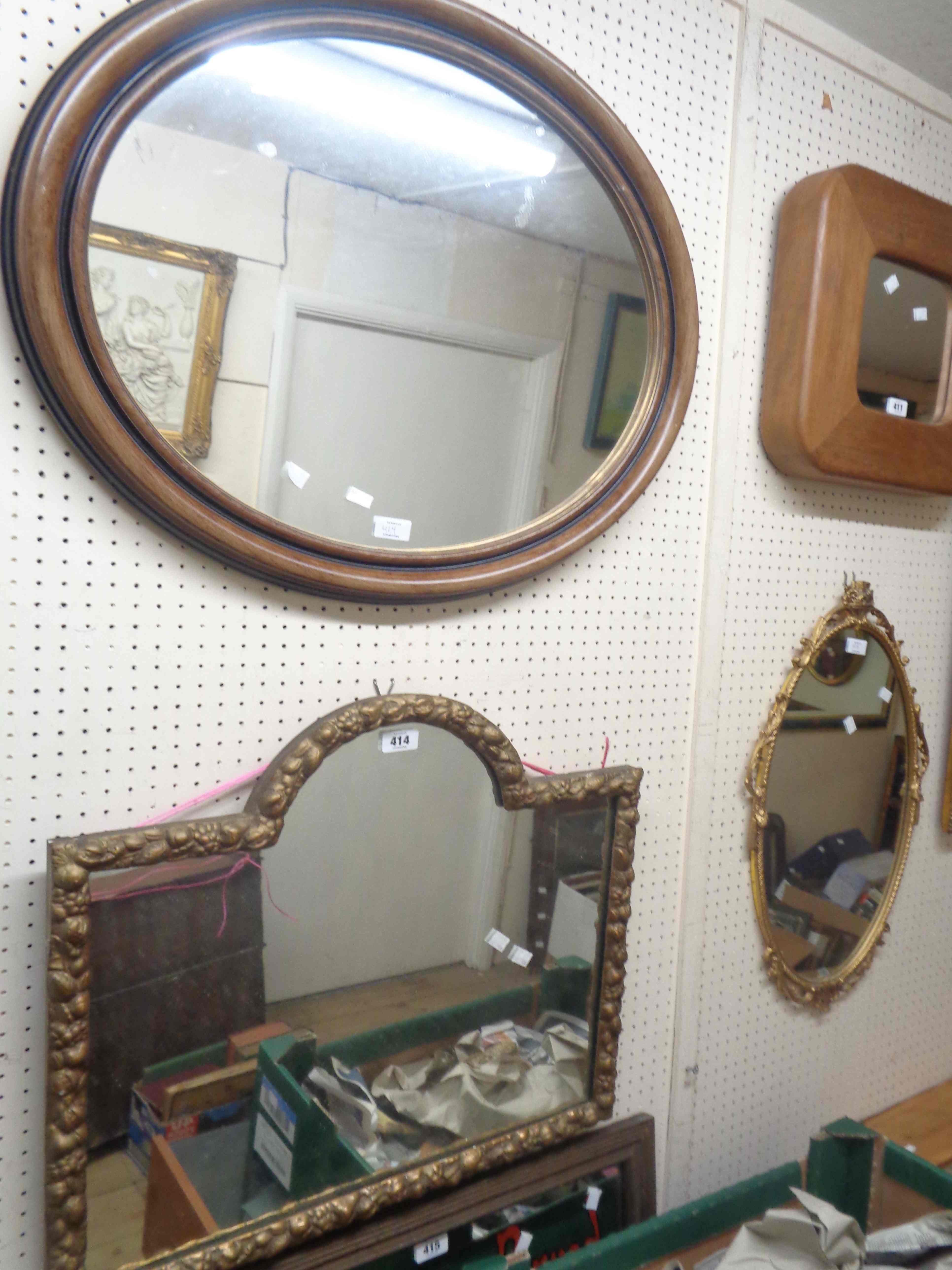 A vintage gilt gesso framed wall mirror with arched plate and fruit border - sold with a 20th