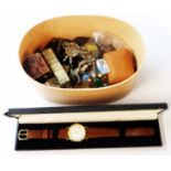 A decorative oval box containing a boxed Accurist quartz goldtone cased wristwatch and various items