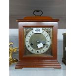 A md 20th Century polished walnut cased bracket clock with brass and silvered square dial and Smiths