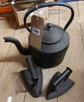 An old cast iron kettle - sold with two flat irons