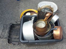 A quantity of copper pans and a cast iron skillet - sold with a quantity of cooking pots etc.