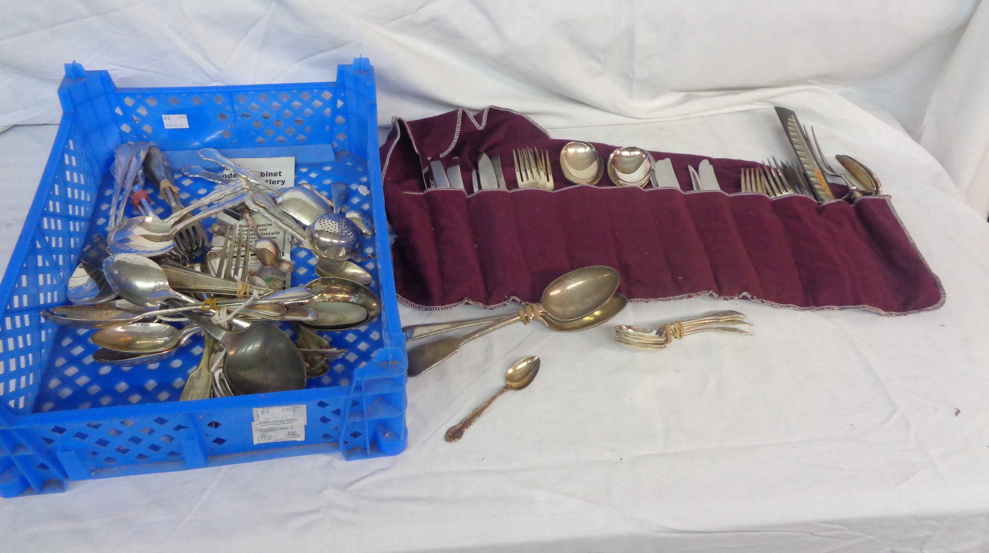 A crate containing a quantity of assorted silver plated cutlery