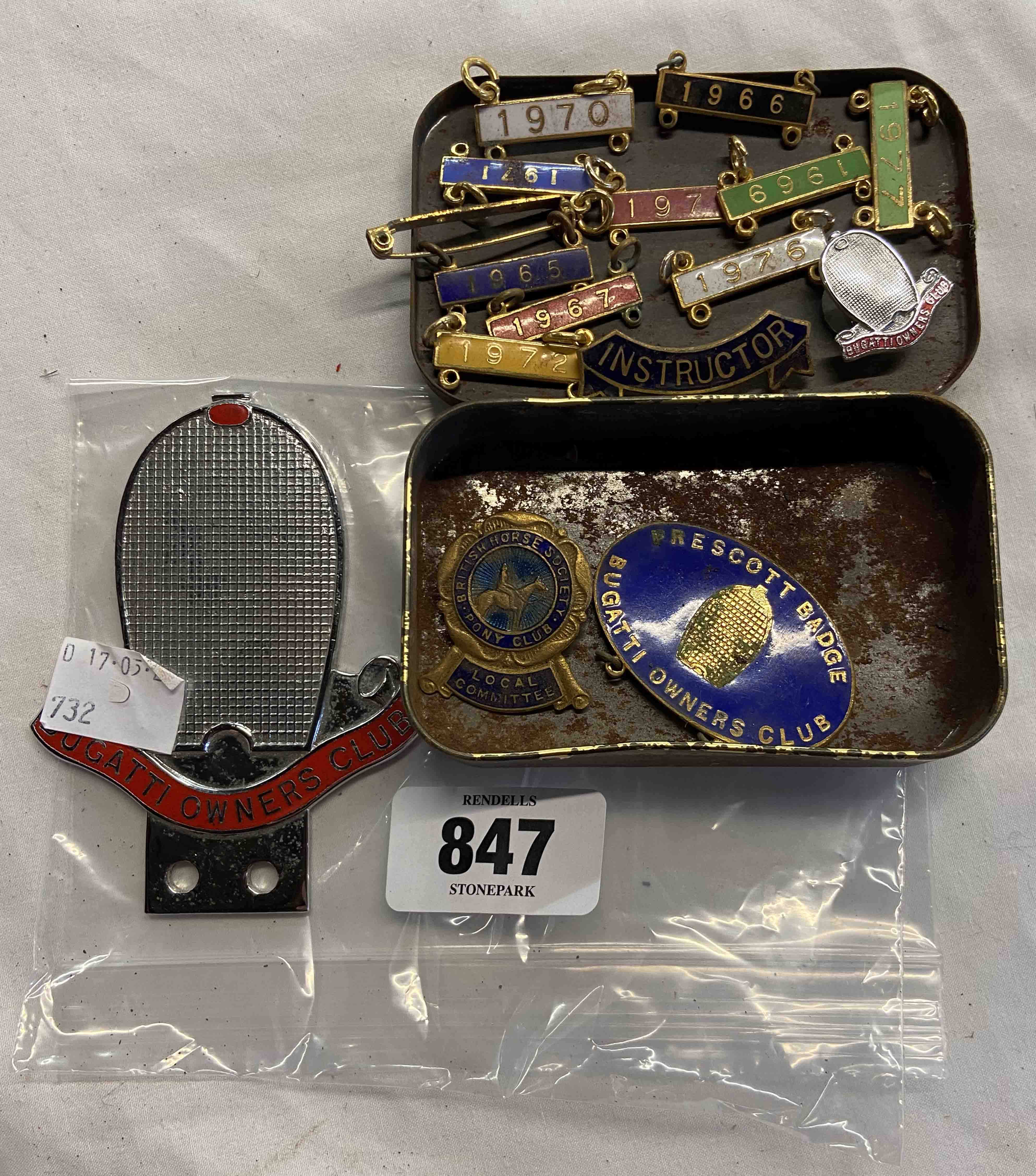 A Bugatti owners club badge - sold with a small tin of Bugatti owner's club enamel badges, etc.