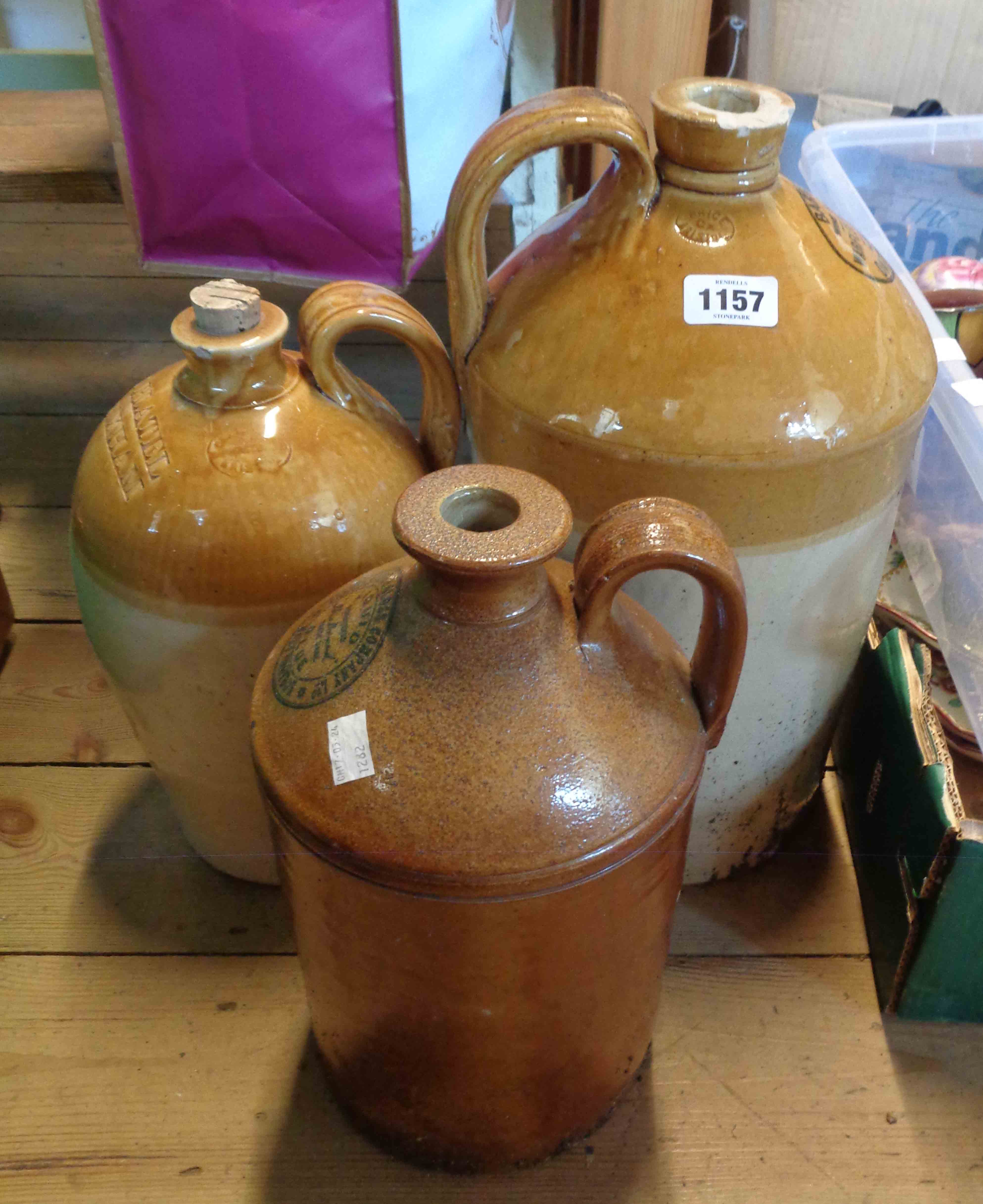 A Bristol glazed stoneware flagon with impressed mark for H. Platel Brixham - sold with a larger