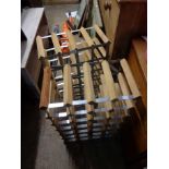 Two twenty-four bottle wood and metal wine racks