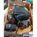 A box containing three vintage cameras including a Praktica Super TL2, etc.