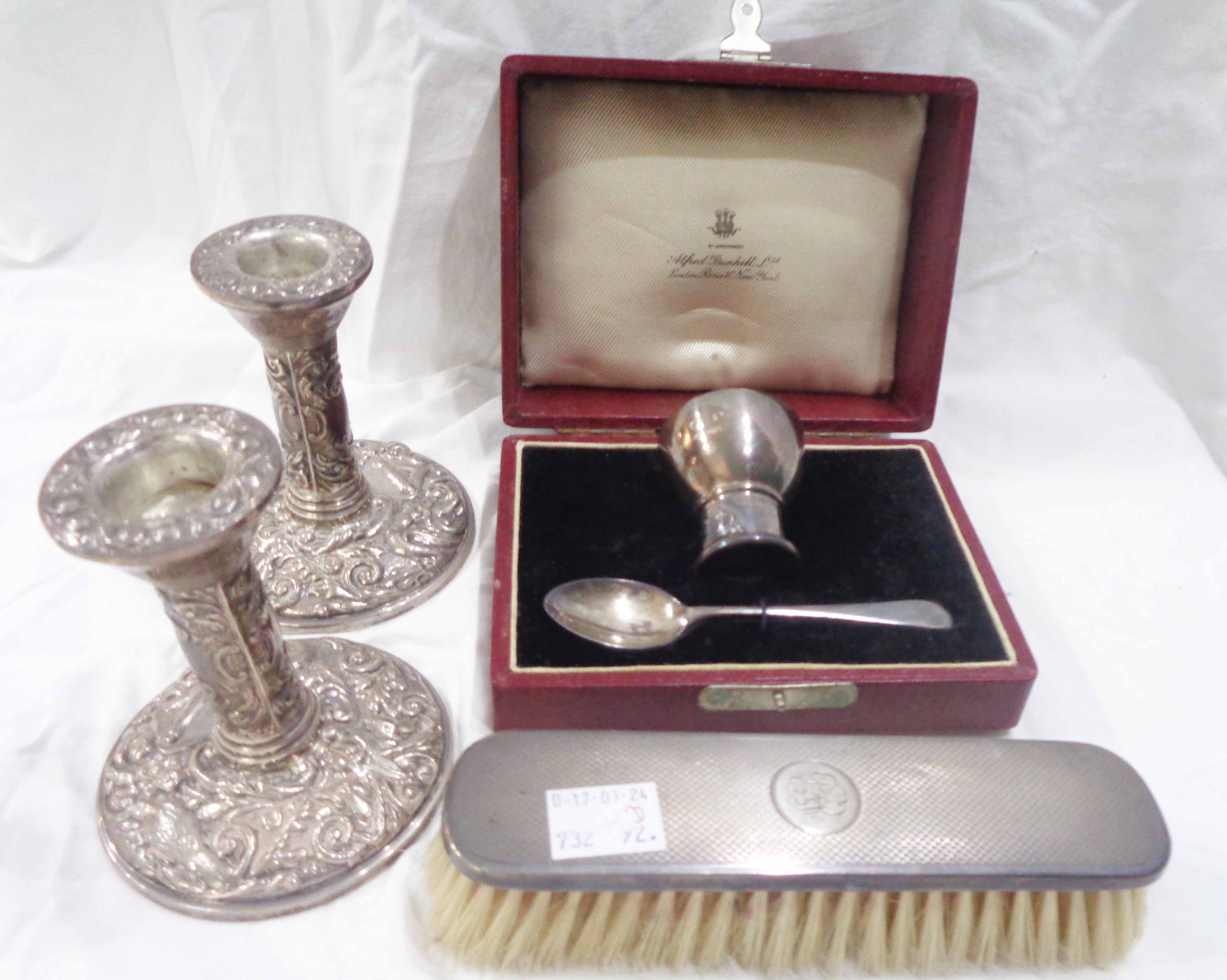 An Alfred Dunhill retailer's box containing a Hukin & Heath silver pedestal egg cup with inscription