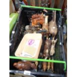 A crate containing a quantity of ceramic horse figurines