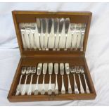 A vintage oak cased set of twelve each Mappin & Webb silver plated fish knives and forks
