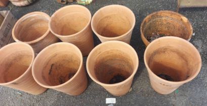 Eight large terracotta pots
