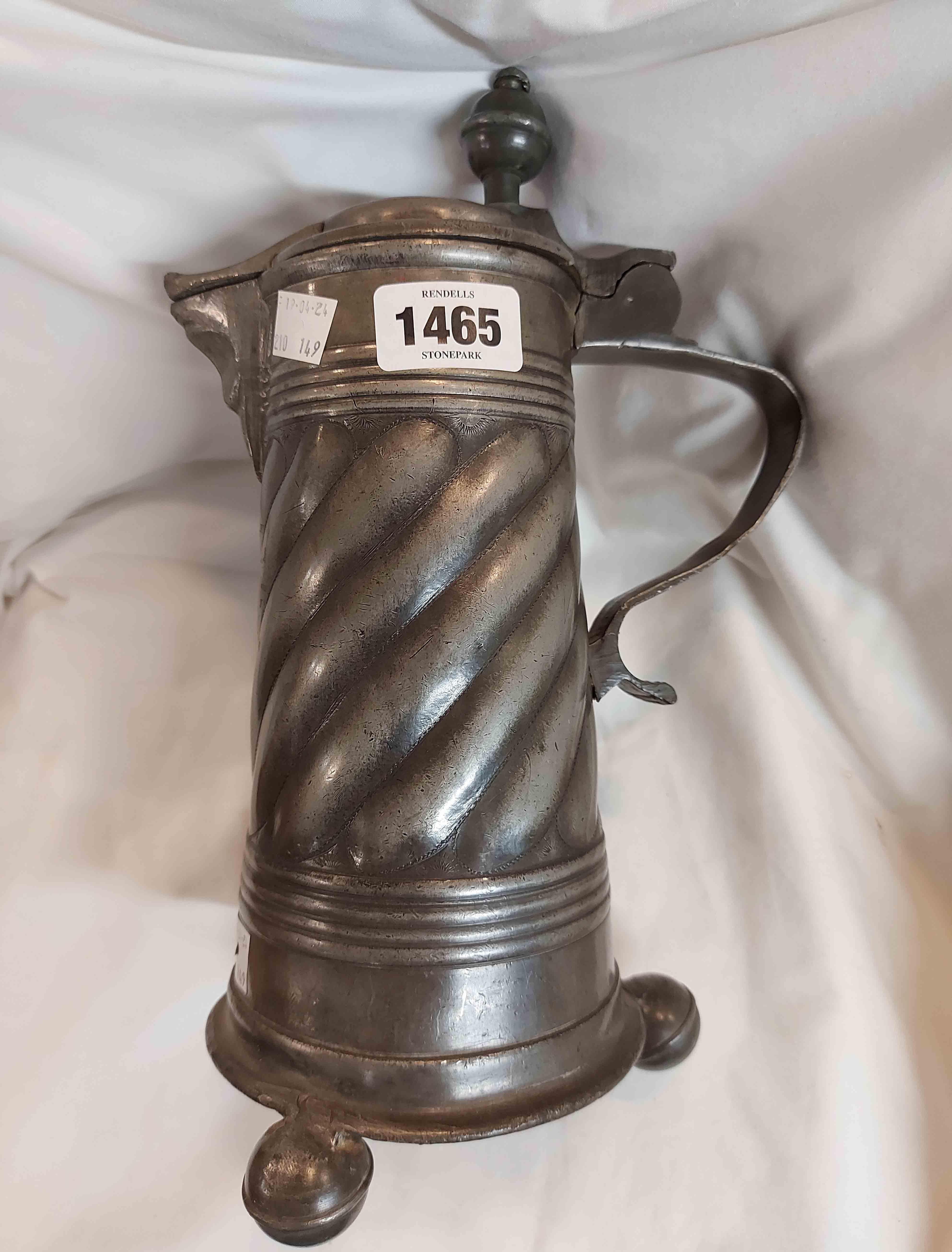 An antique pewter tankard with thumb-lift lid and wrythen body set of three ball feet - touchmarks