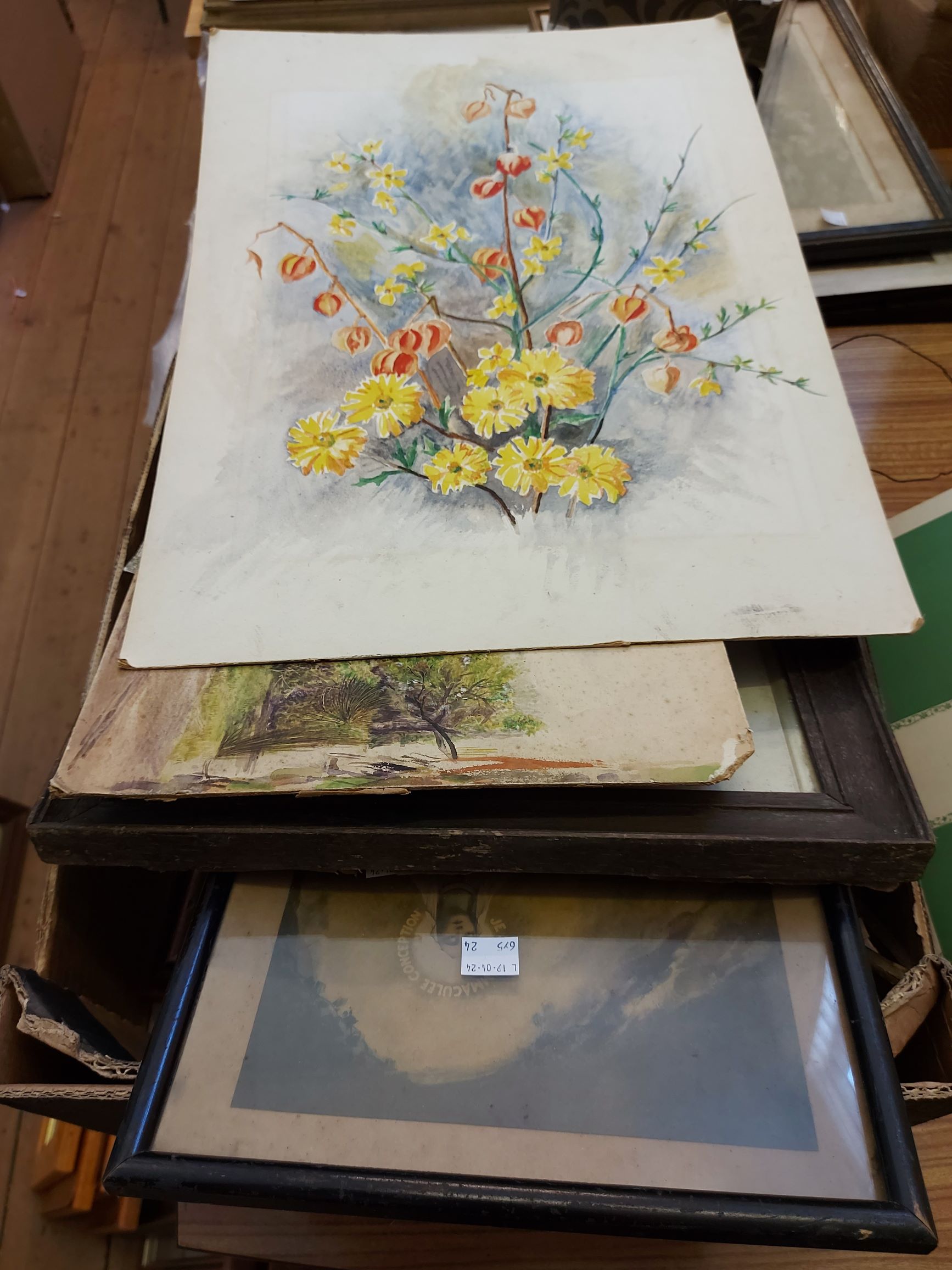 A box containing a quantity of pictures including an unframed watercolour still life depicting