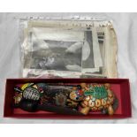 A box containing a quantity of tortoise related items including enamelled brooches, vintage wind-