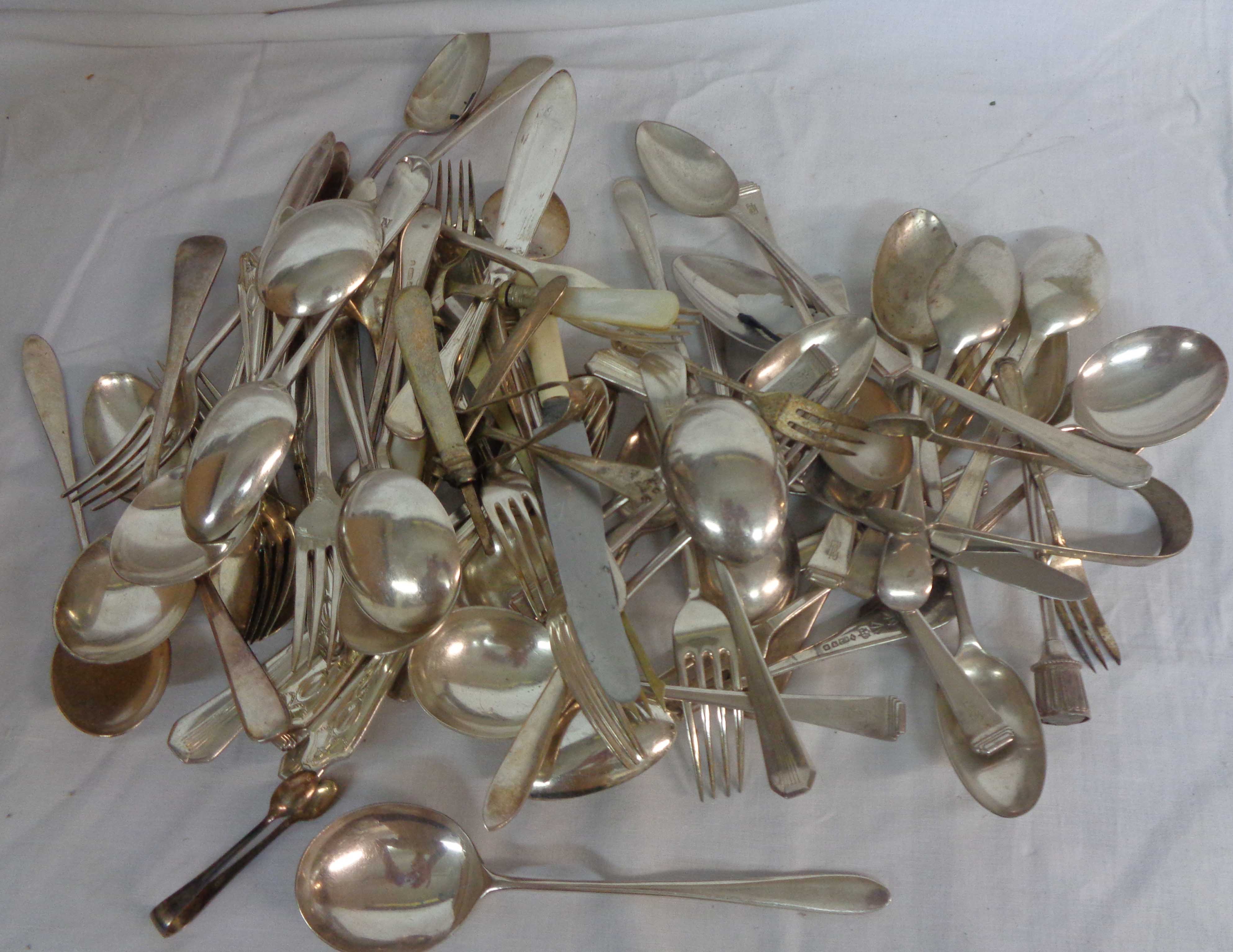 A box containing a quantity of assorted silver plated cutlery - various age, maker and design