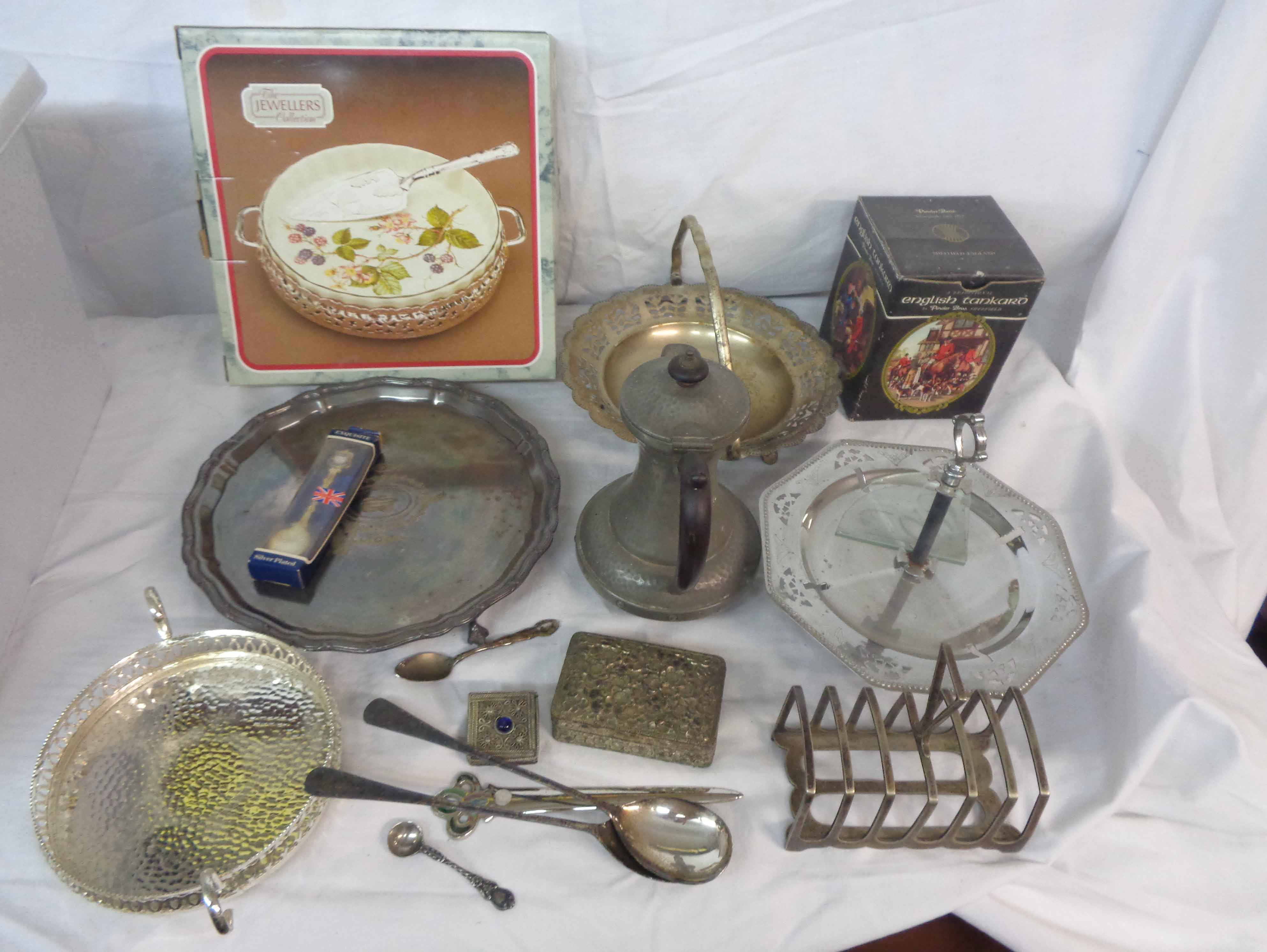 A crate containing a quantity of silver plated and other items including swing handled basket,