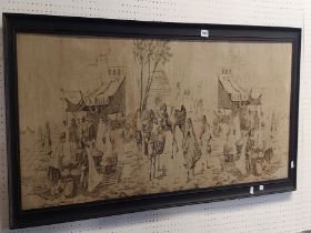 A framed tapestry panel, depicting a market street scene with camels, fruit sellers, etc.
