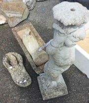 A concrete planter, bird figure, classical child and a boot