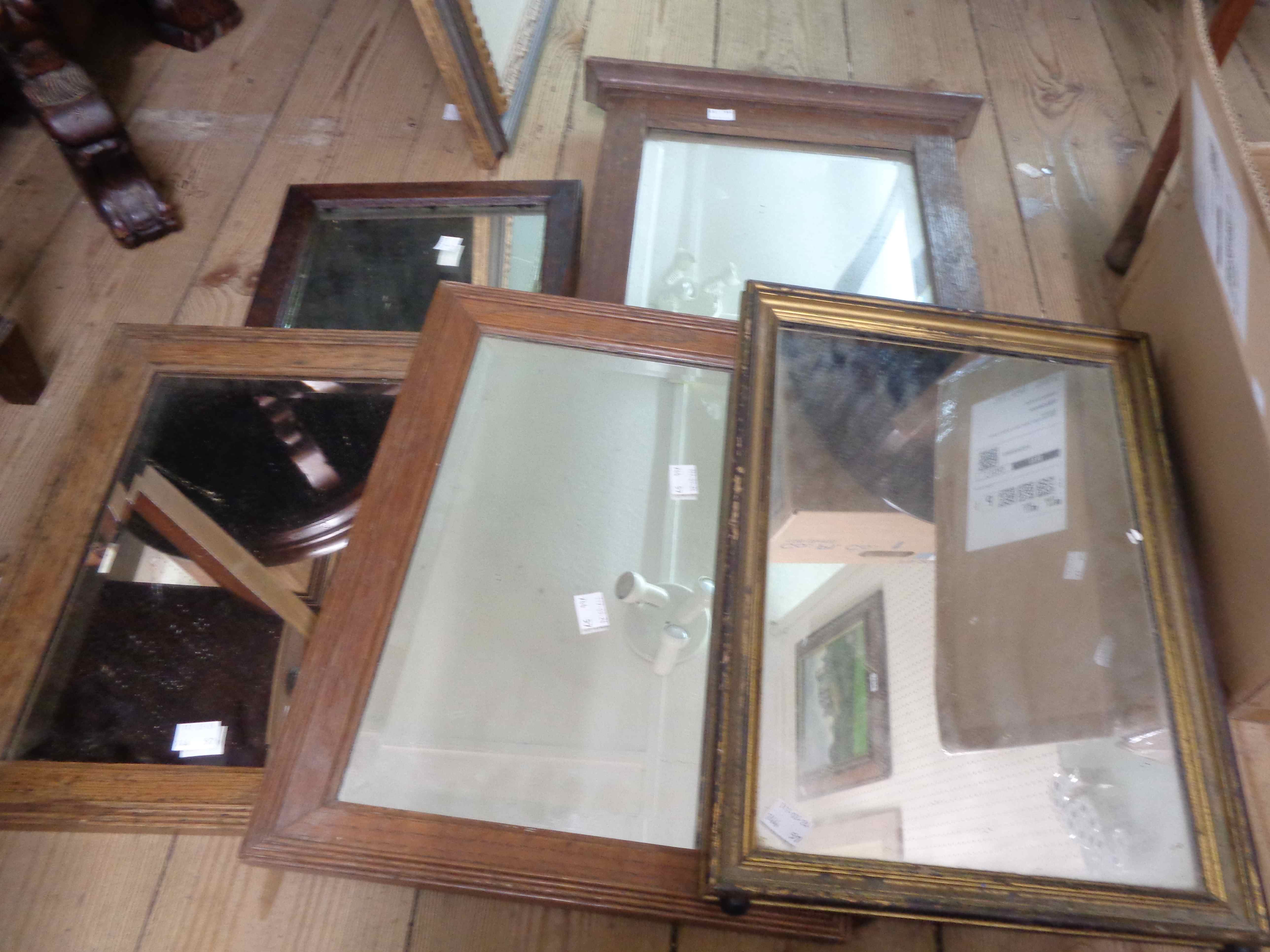 Four assorted small oak framed oblong wall mirrors - sold with a gilt framed similar