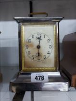 An early 20th Century Haller chrome plated cased musical alarm clock playing 'No Place Like