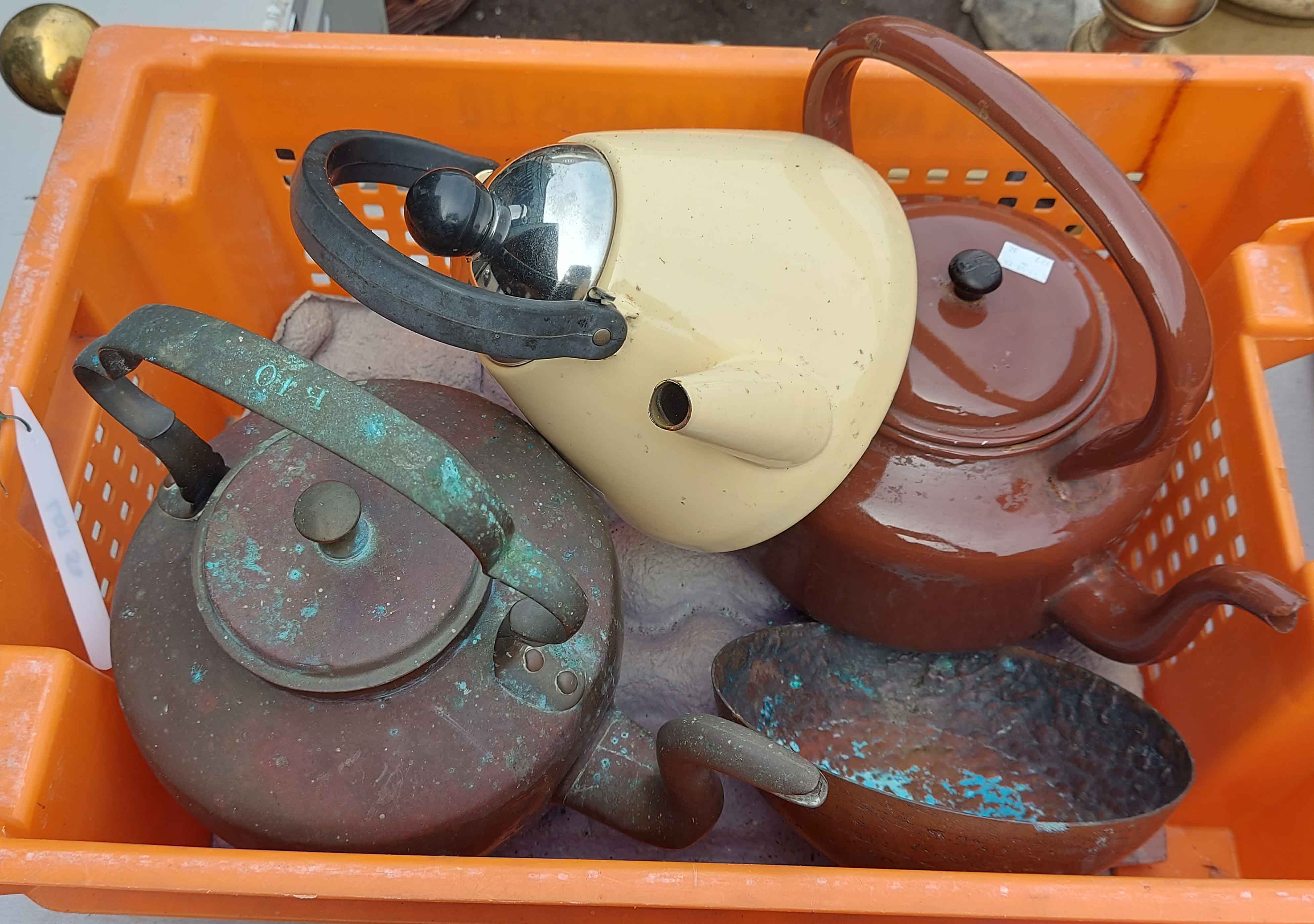 Two old kettles and a modern stove kettle