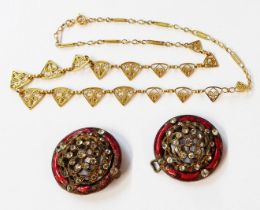 A middle eastern yellow metal filigree dental-link necklace - sold with a vintage white paste and