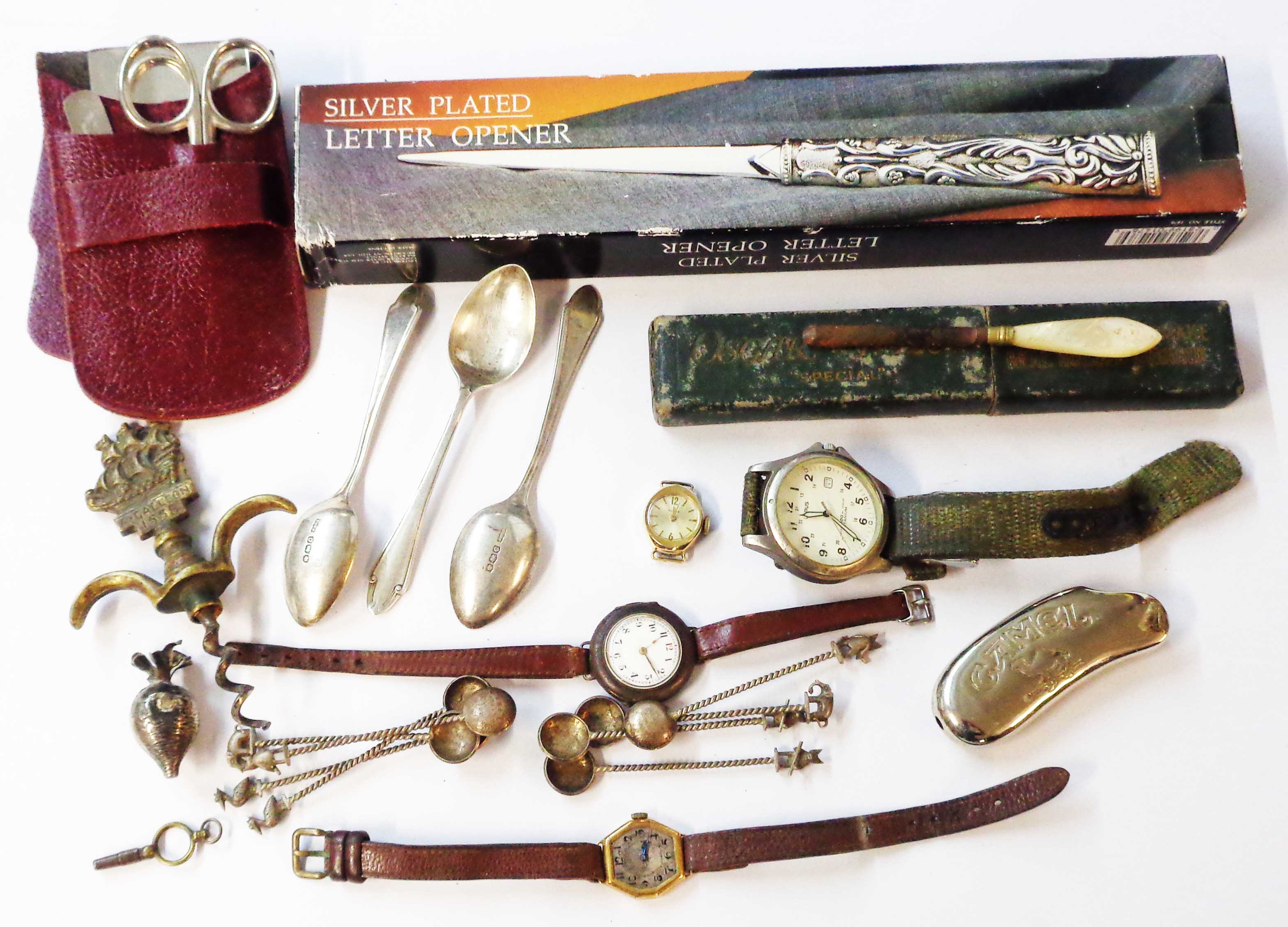 A bag containing a damaged marked 18K vintage lady's wristwatch, three English silver teaspoons,