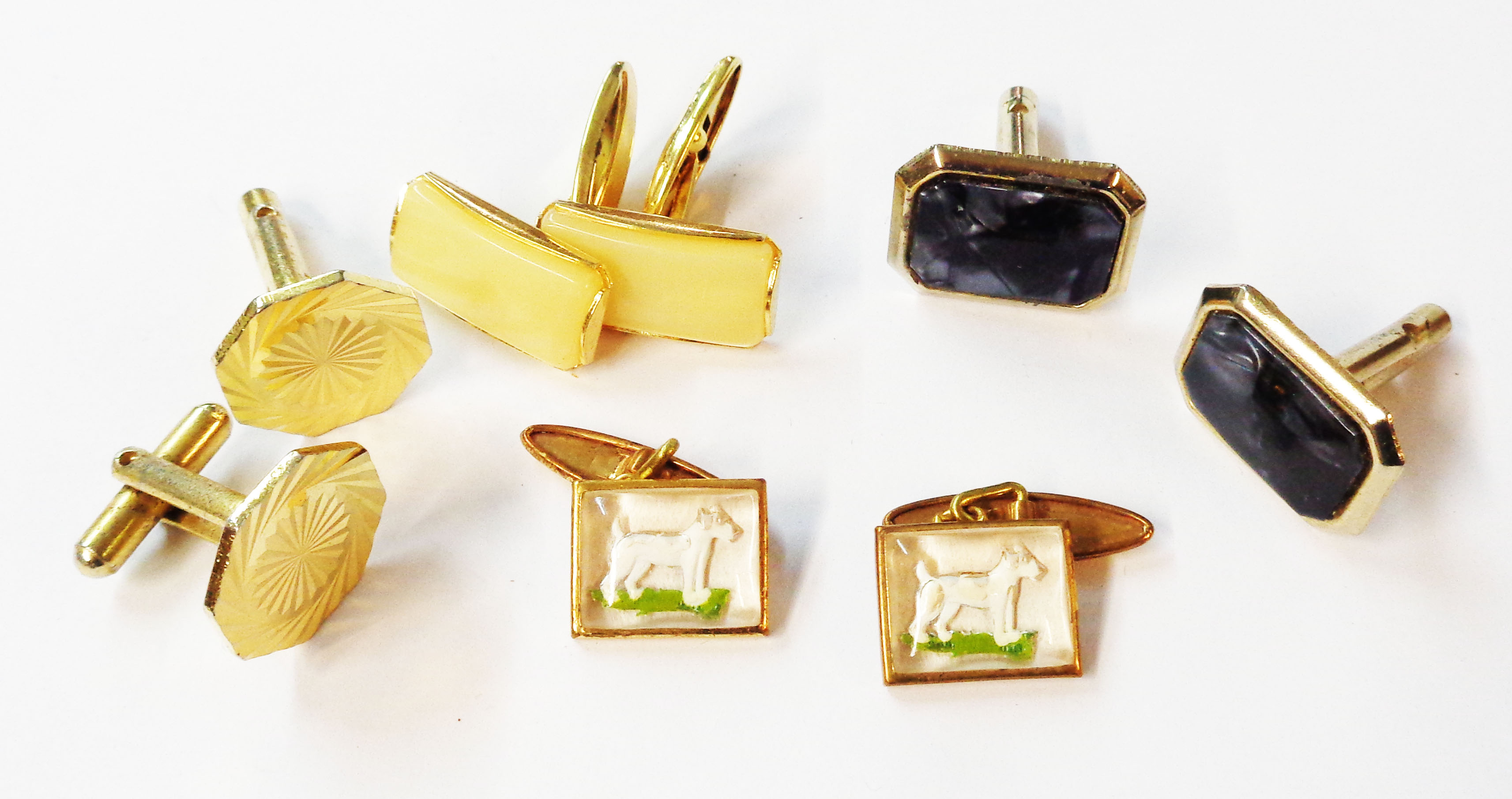 Four pairs of goldtone cufflinks including a pair of Essex crystal style reverse painted white dog