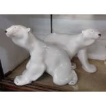 Two large Lomonosov Russian pottery Polar Bear figurines, with painted detailing and a white glaze