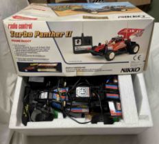 A 1/15 scale Nikko Turbo Panther II RC toy car