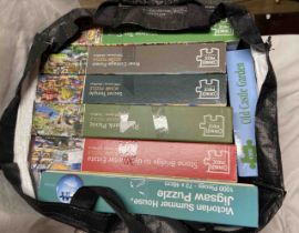 Two bags containing a quantity of modern jigsaw puzzles