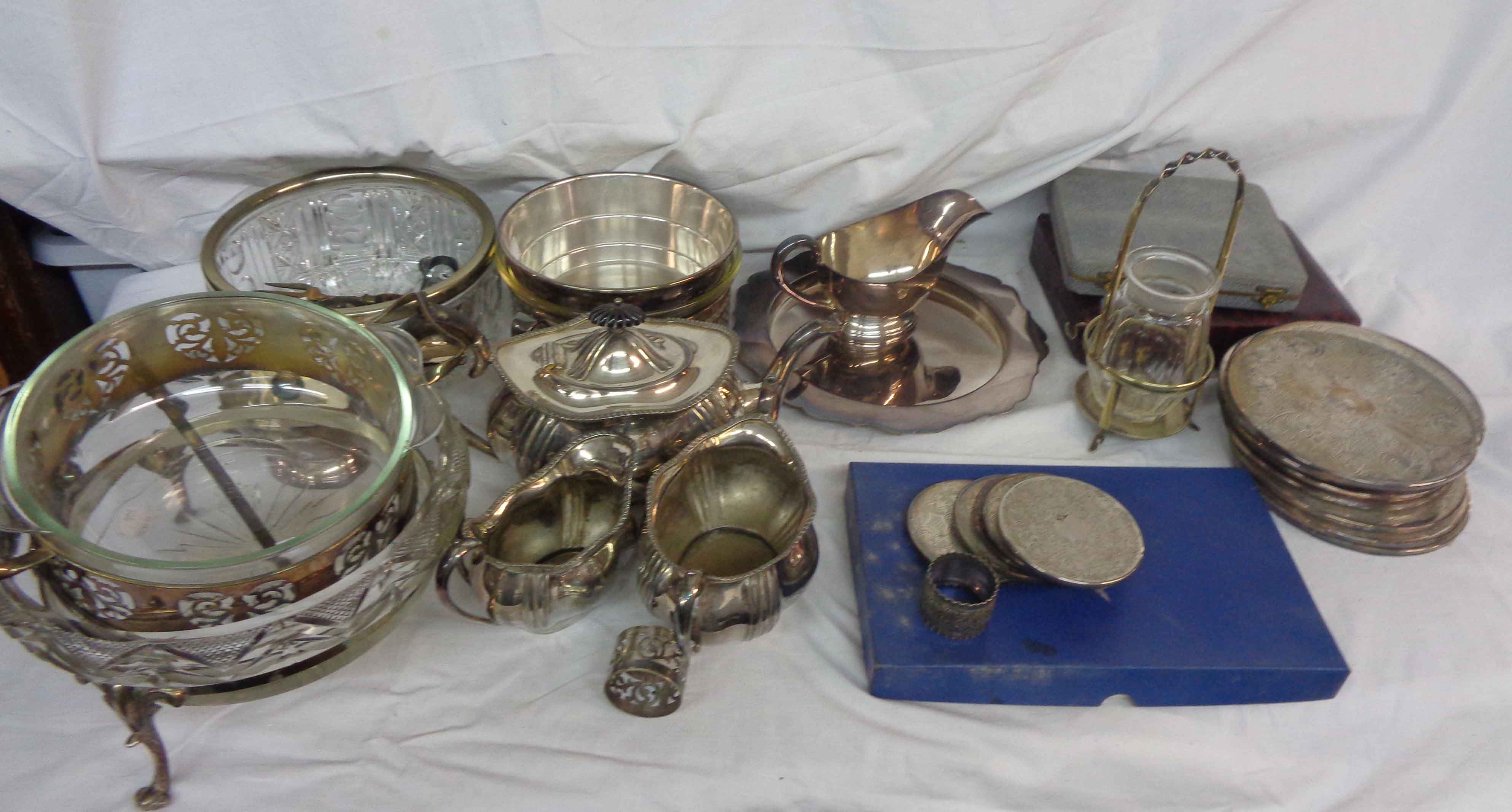 A crate containing a large quantity of assorted silver plated items including teaware, cutlery,