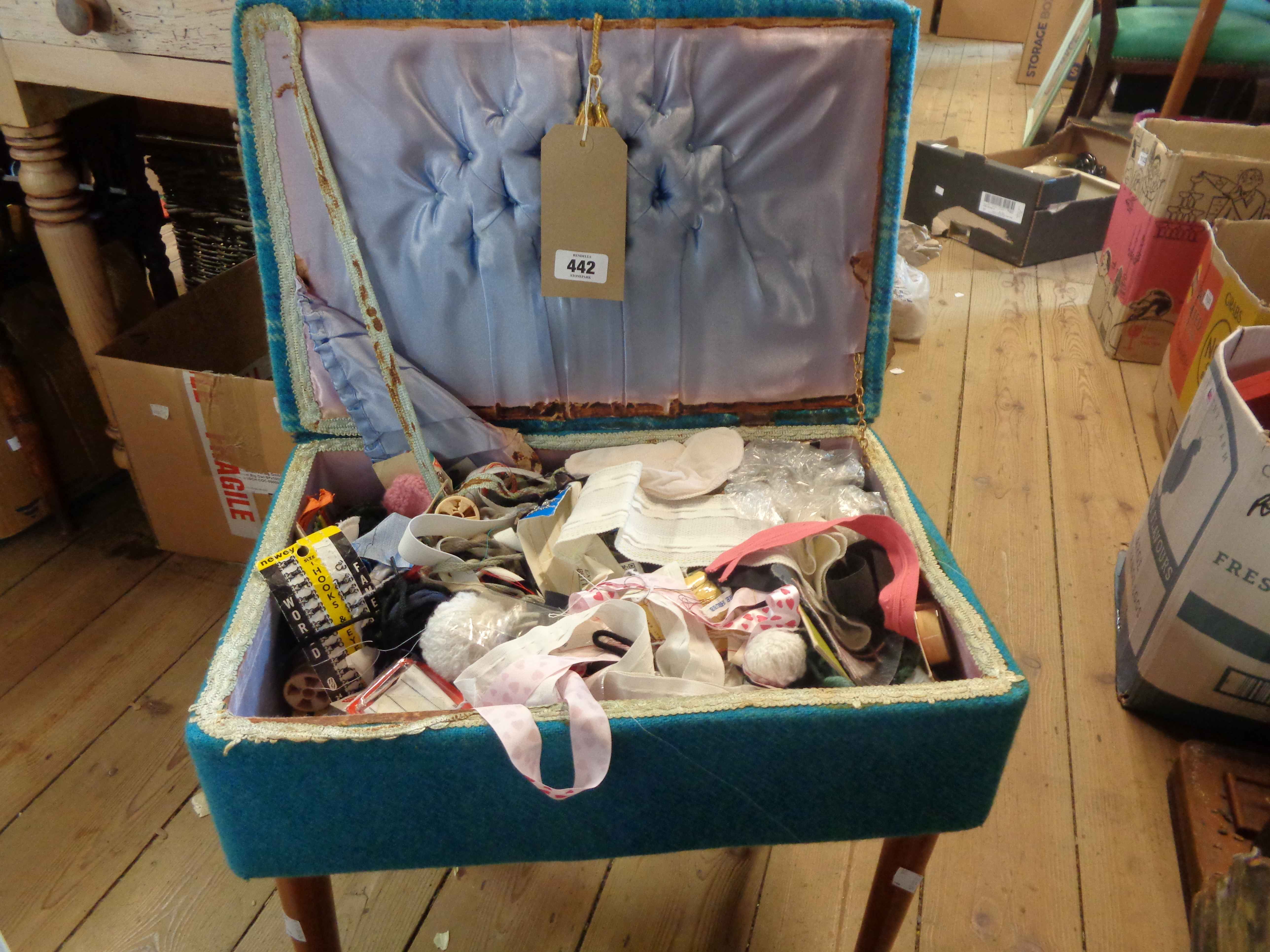 A vintage blue material upholstered lift-top sewing box with assorted contents, set on tapered - Image 2 of 2