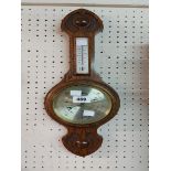 A small polished oak banjo barometer/thermometer by Comitti of London with gilt dial and aneroid
