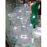 A quantity of glassware comprising three decanters, vase and green jug