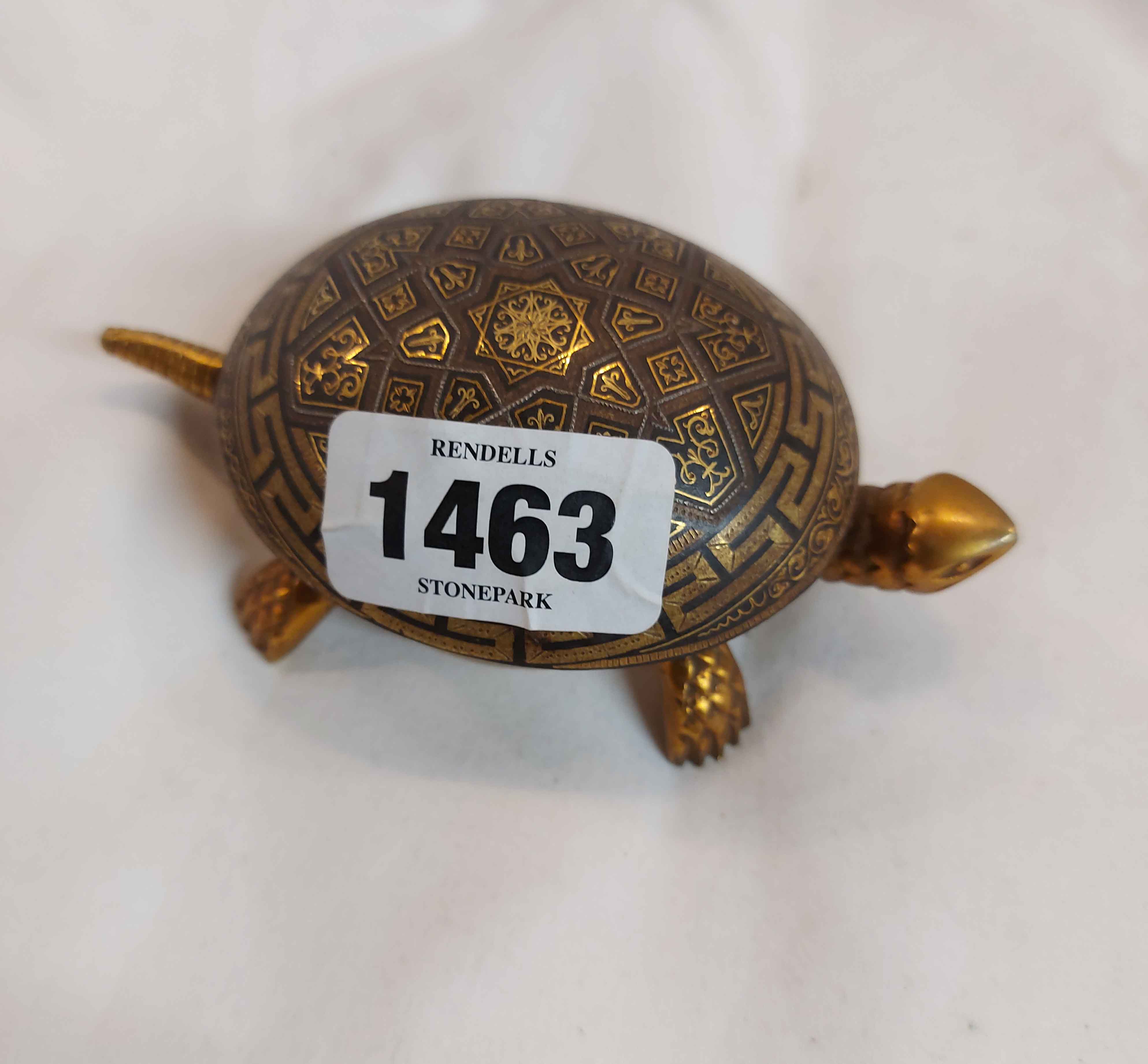 A small mechanical shop counter bell in the form of a brass tortoise with a gilt Damascene