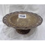 A late Victorian silver pedestal bon bon dish with pierced and embossed decoration and central