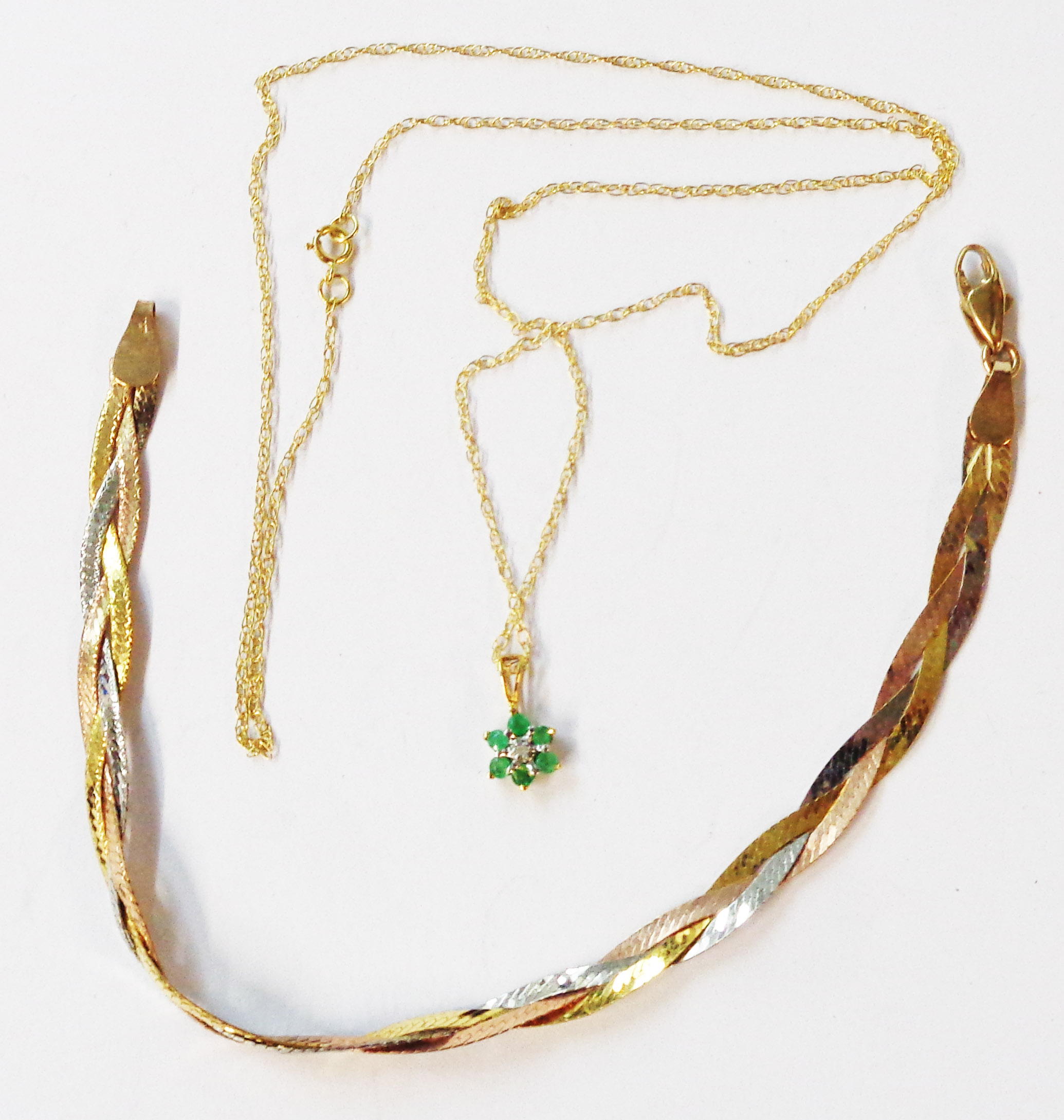 A boxed 375 (9ct.) three colour gold bracelet - sold with a marked 375 flowerhead pendant, set