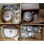 Four boxes containing a large quantity of Noritake porcelain tea and dinner ware including cups