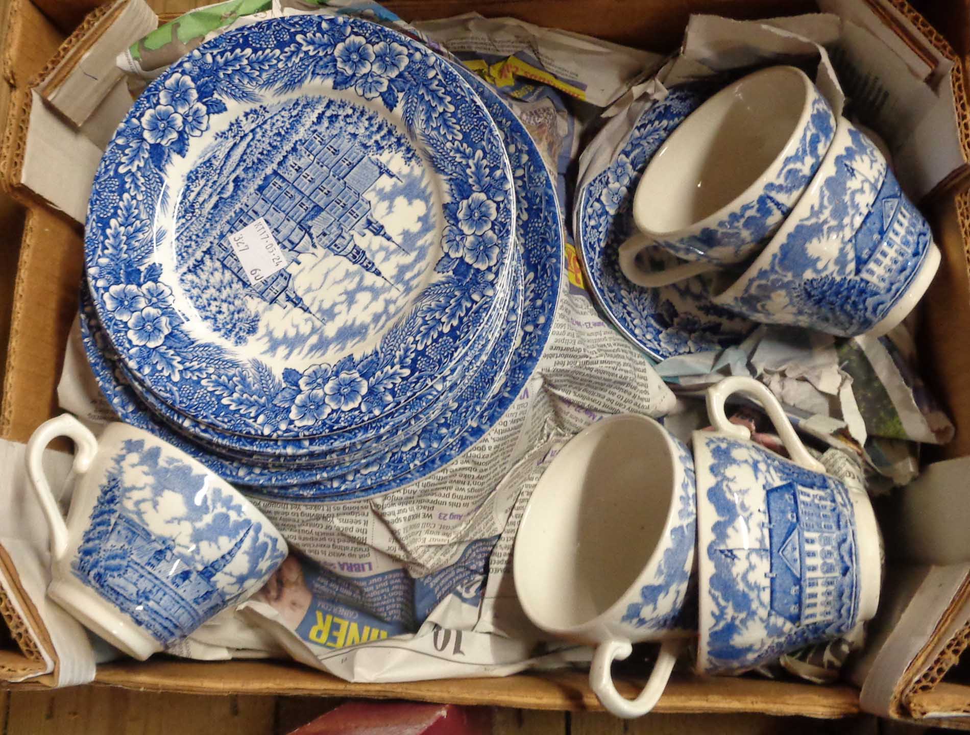 A box containing a quantity of blue and white tableware