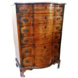 A 75cm antique figured walnut and cross banded serpentine front chest with flight of six long