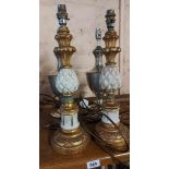 A pair of painted giltwood candlestick style lamps with pineapple decoration