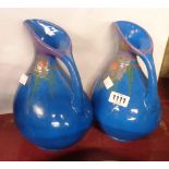 A pair of Daison Art Pottery Torquay vases of ewer form with Art Nouveau style painted fruit