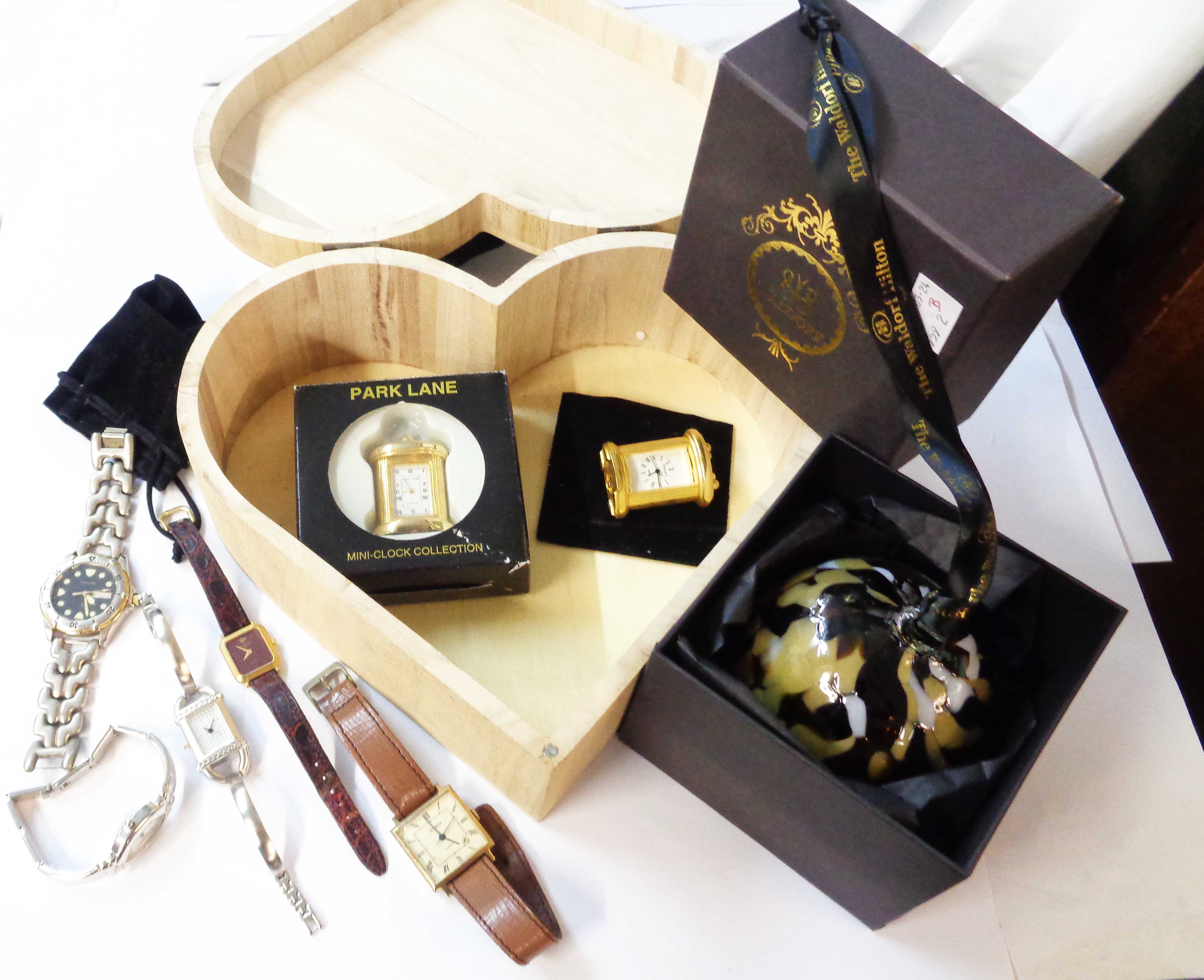 A wooden heart shaped box containing a vintage Seiko square dial wristwatch (a/f), four modern