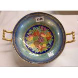 An early 20th Century Mintons bone china lustre decorated two-handled bowl, the central panel with