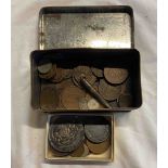 A tin containing a small collection of coins